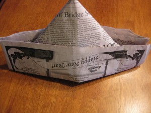 Newspaper hat by  Kate Ter Haar